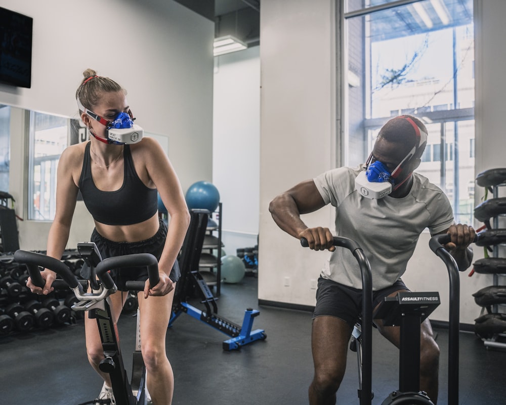 a man and a woman in a gym