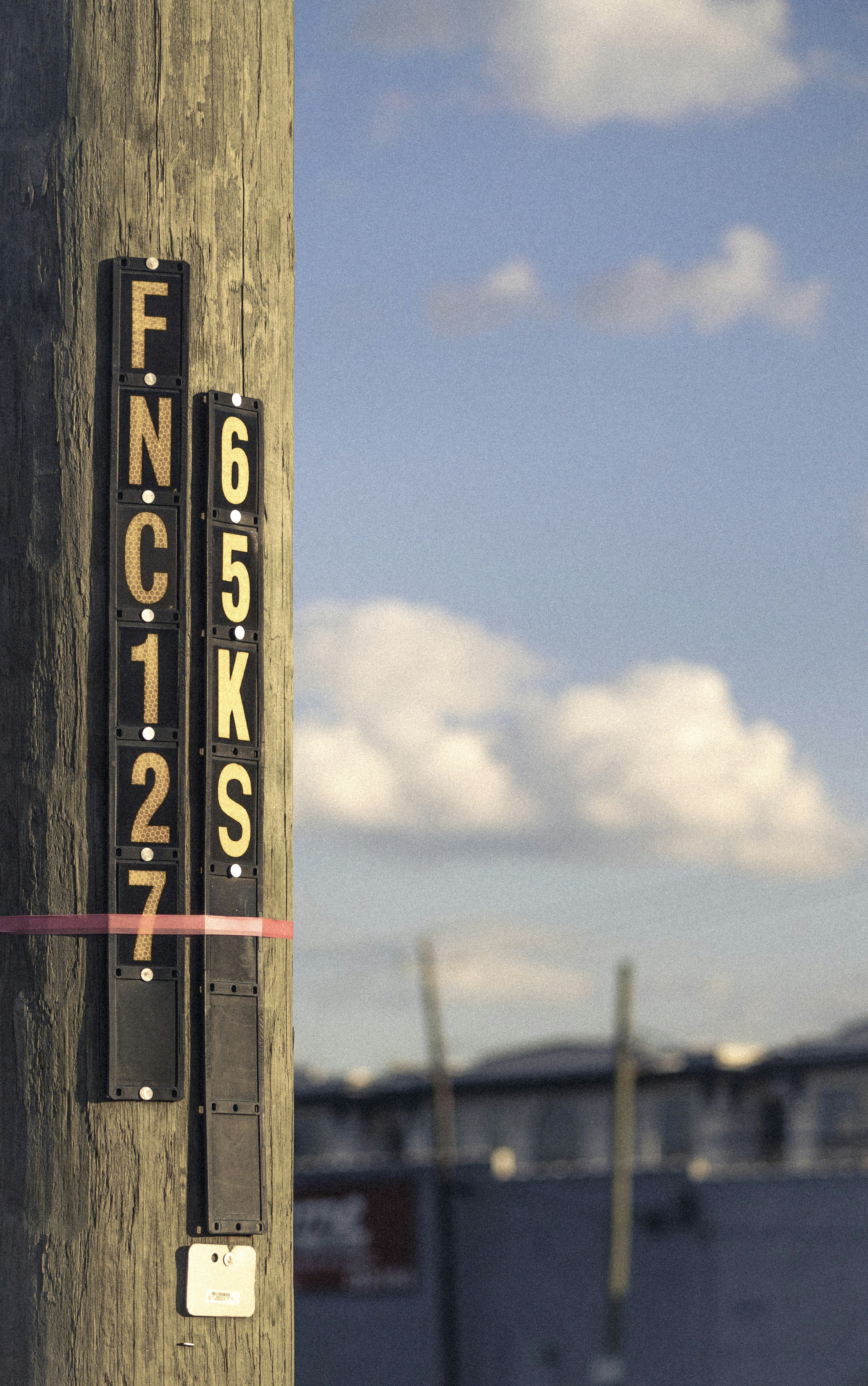 a telephone pole with a sign on it
