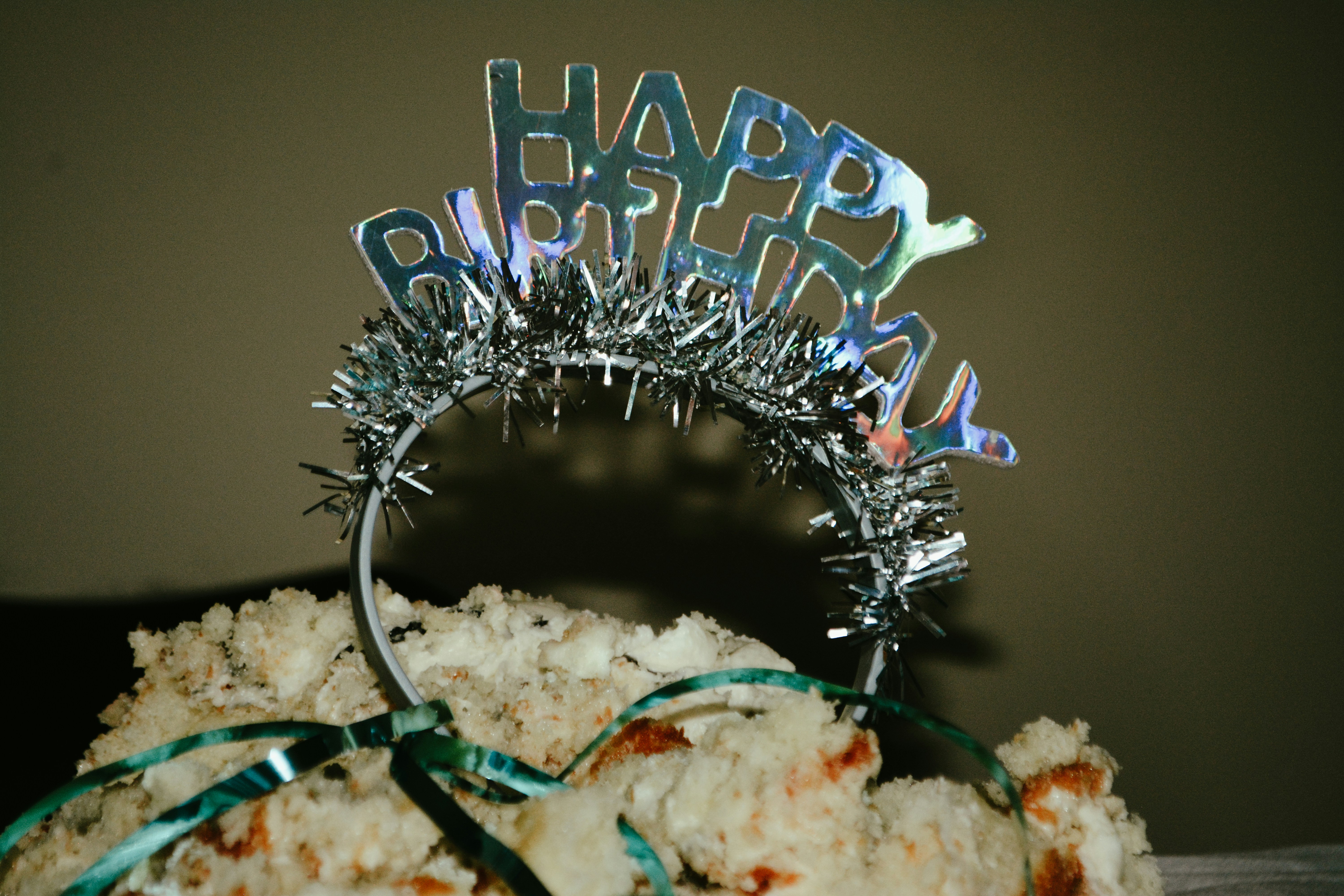 A birthday cake with a tiara on top of it