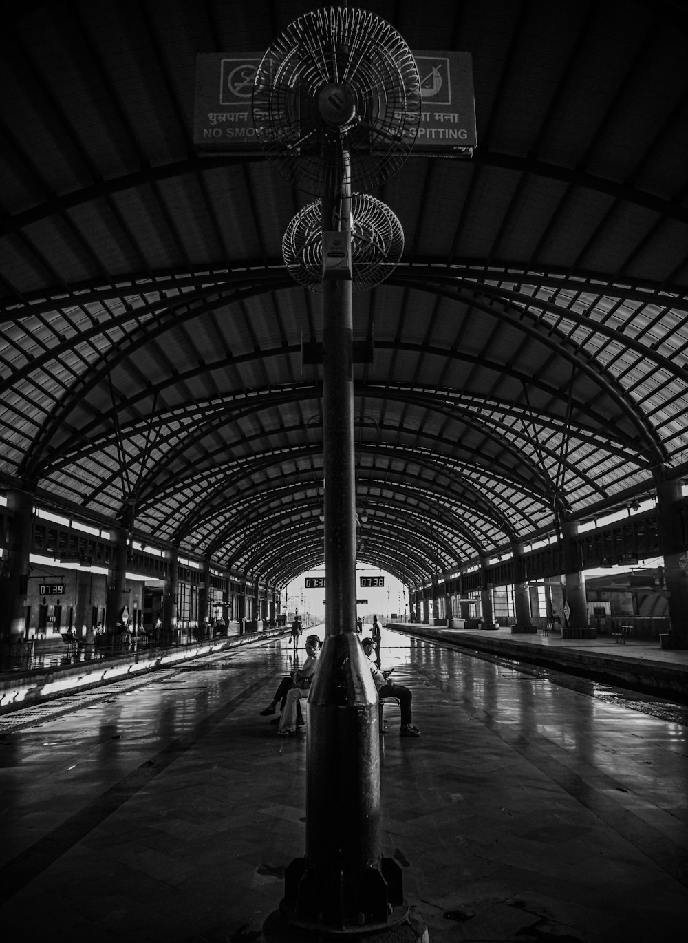 a black and white photo of a train station