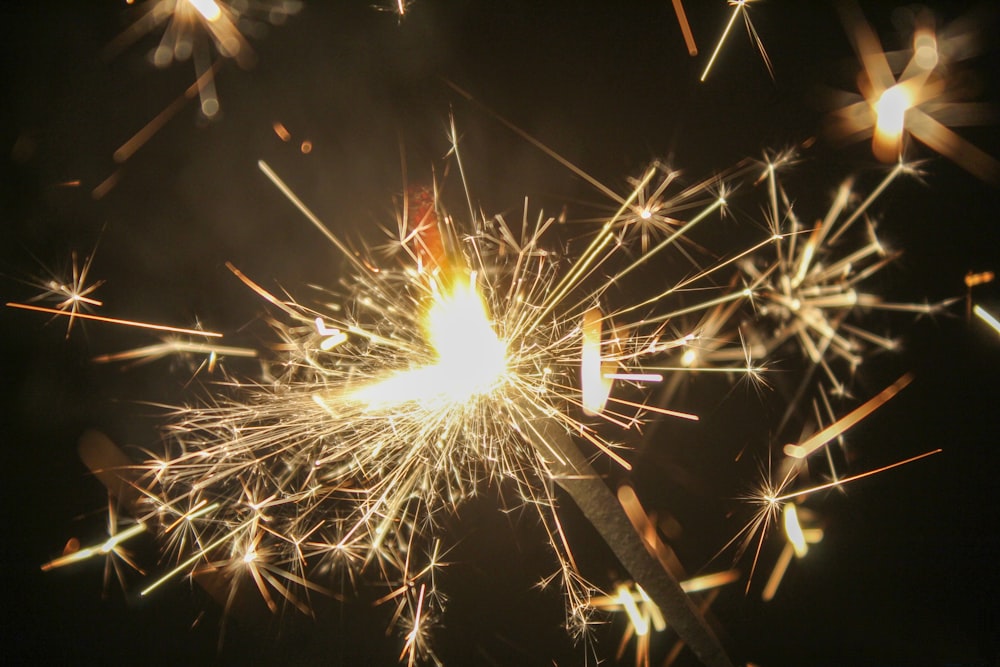 a close up of a sparkler on a black background