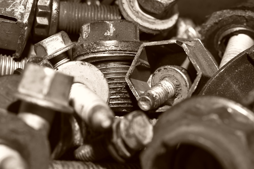 a pile of nuts and bolts sitting next to each other