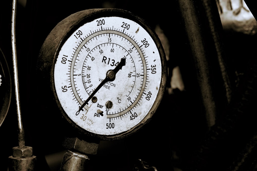 a close up of a thermometer on a motorcycle