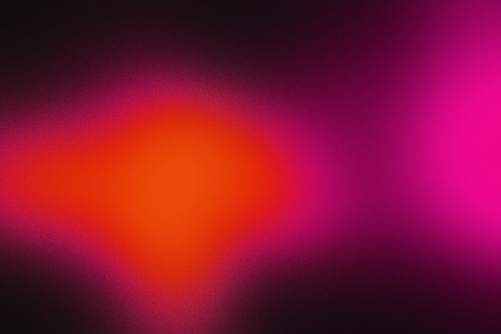 a red and pink background with a black background