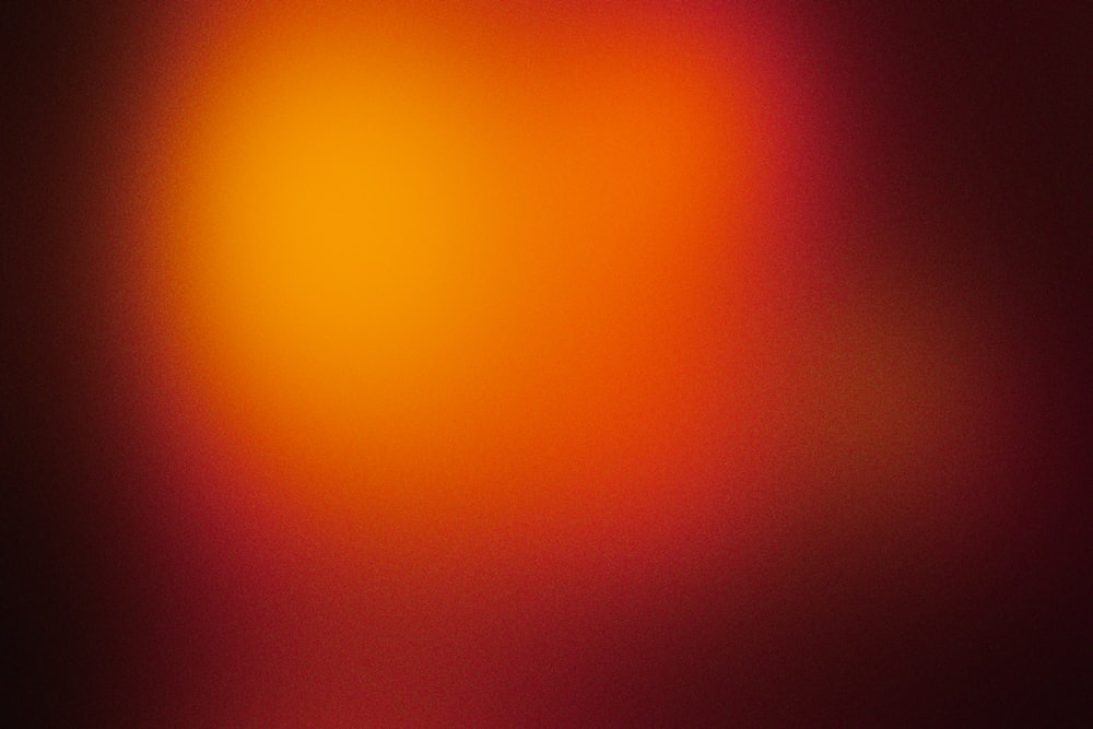 a blurry image of a red and yellow light