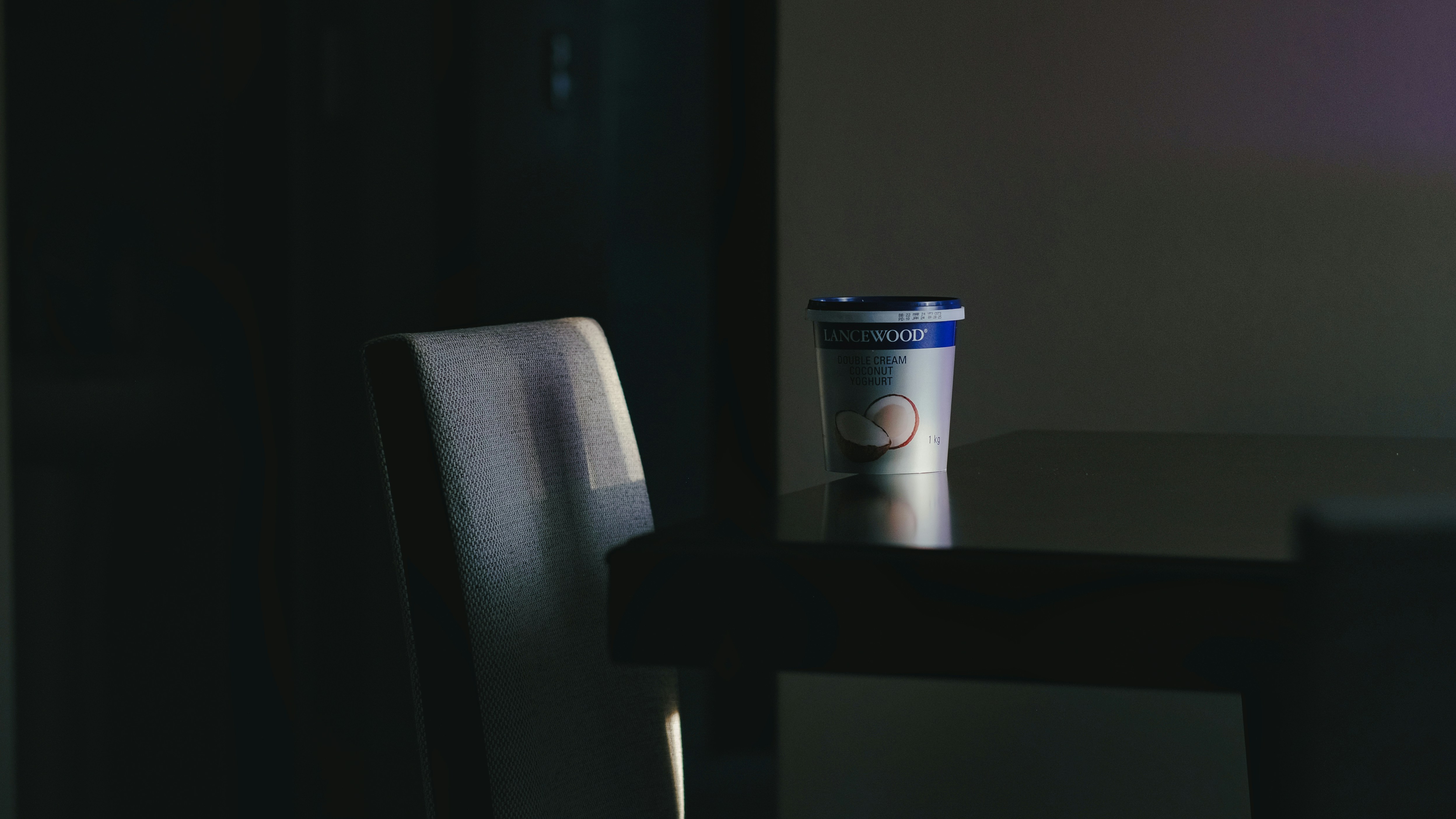 a coffee cup sitting on top of a wooden table