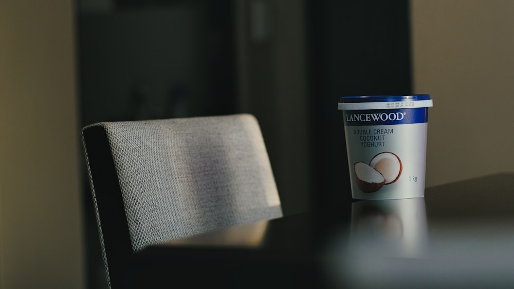 a cup of coffee sitting on top of a table