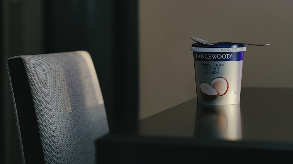 a cup of ice cream sitting on top of a table