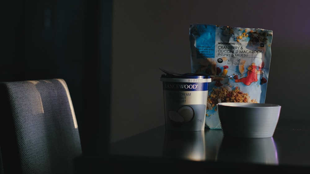 a table with a cup and a bag on it