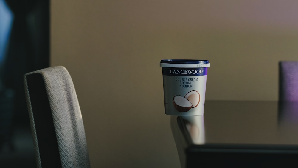 a cup of coffee sitting on top of a table