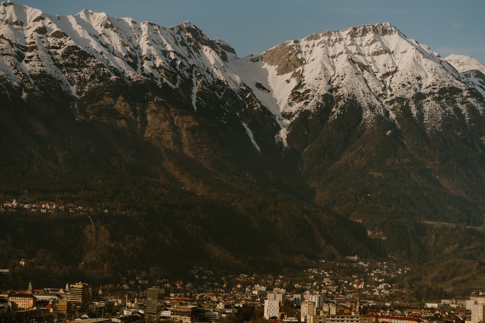 a view of a city with mountains in the background