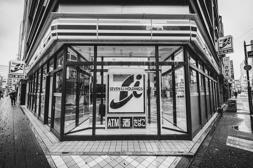 a black and white photo of a bus stop