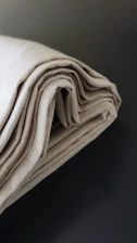 a close up of a folded cloth on a table