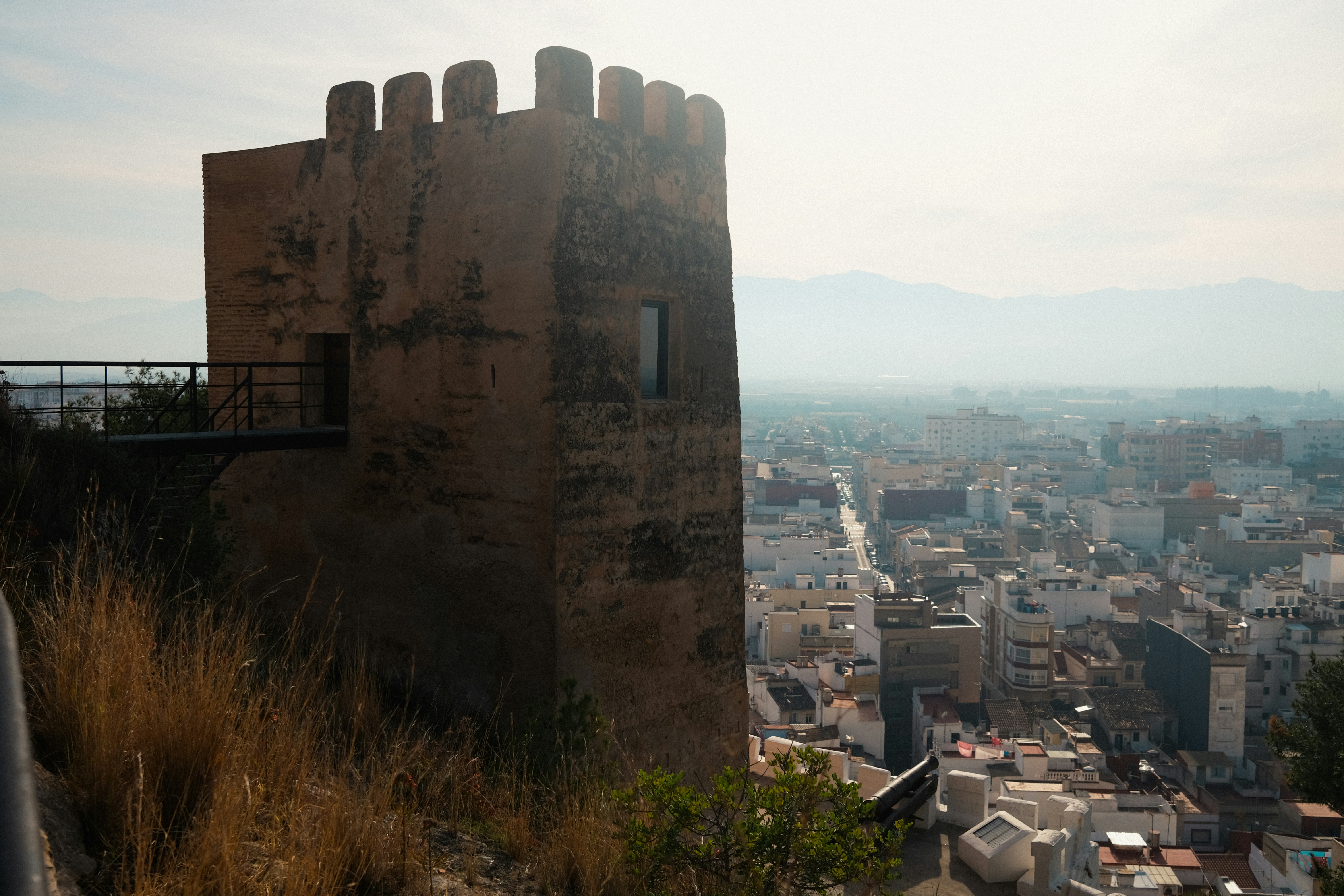 a view of a city from the top of a hill