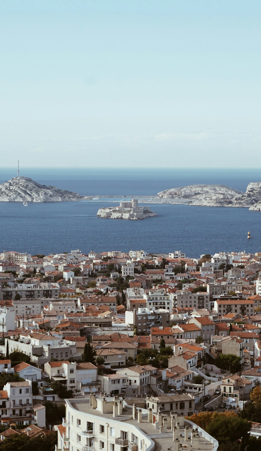 a large body of water sitting next to a city