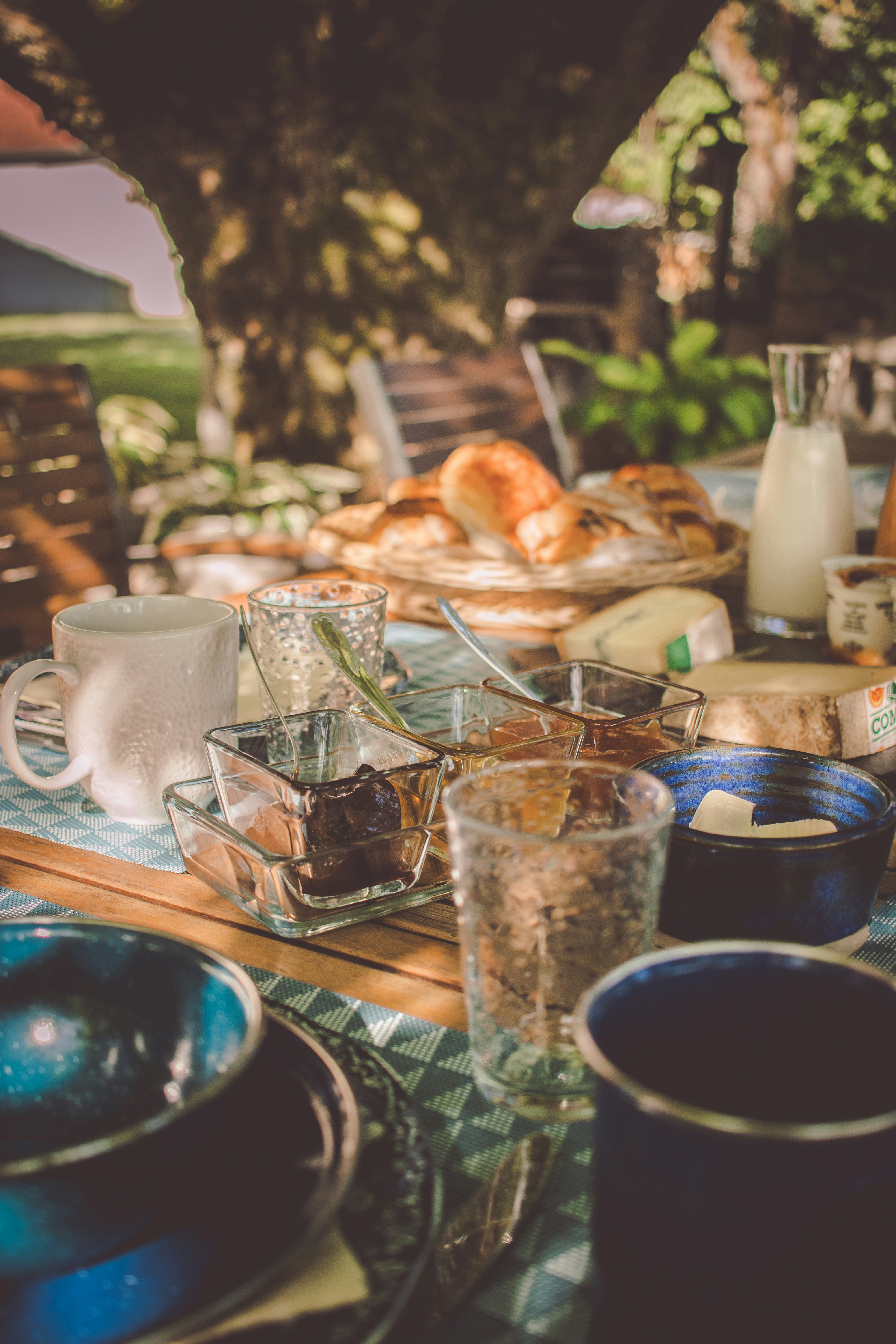 Breakfast spread with fresh pastries, fruit, and Andalusian specialties on a terrace