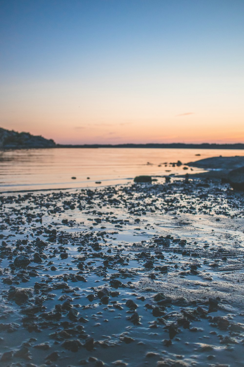 a view of a body of water at sunset