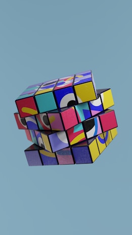 a multicolored cube is flying in the sky