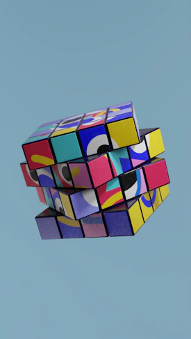 a multicolored cube is flying in the sky