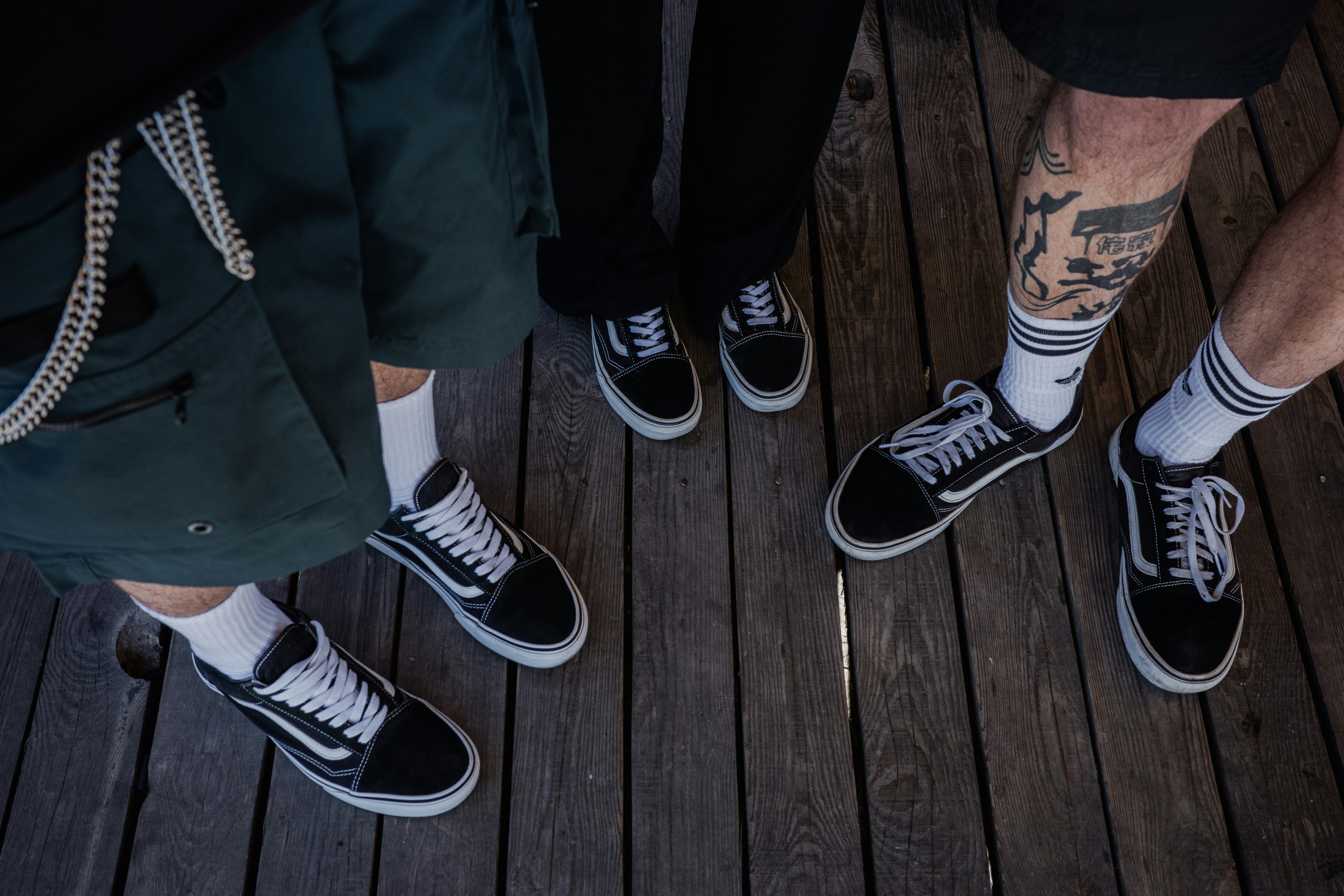 a group of people standing on top of a wooden floor