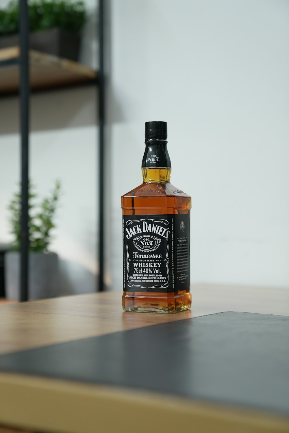 a bottle of jack daniels whiskey sitting on a table