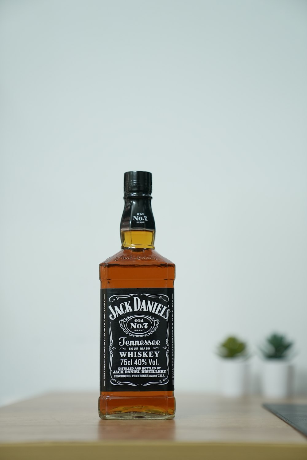 a bottle of jack daniels whiskey sitting on a table