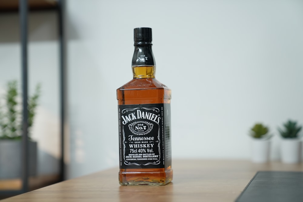 a bottle of jack daniels whiskey sitting on a table