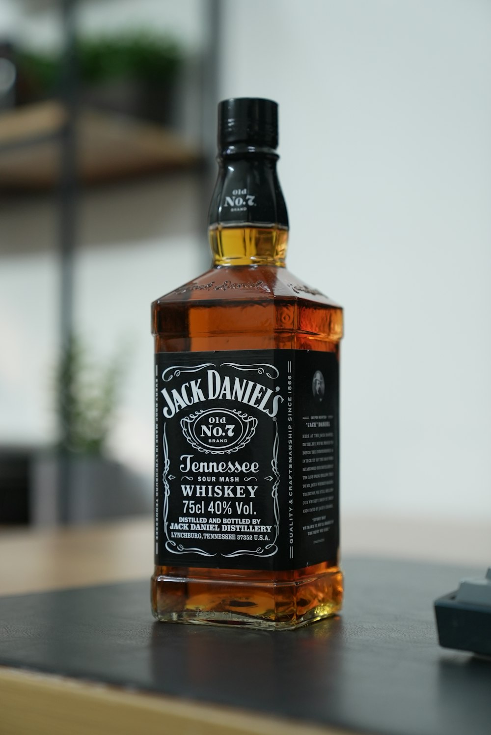 a bottle of jack daniels whiskey sitting on a table