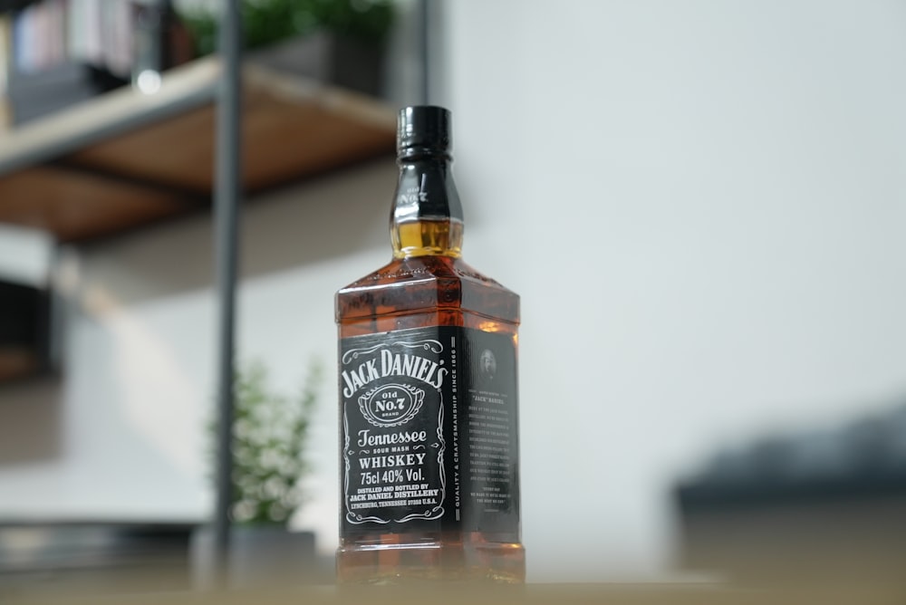 a bottle of whiskey sitting on top of a table
