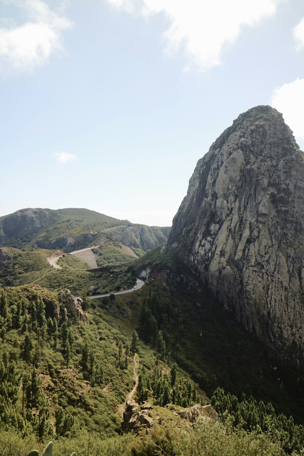 a view of a mountain with a road going through it