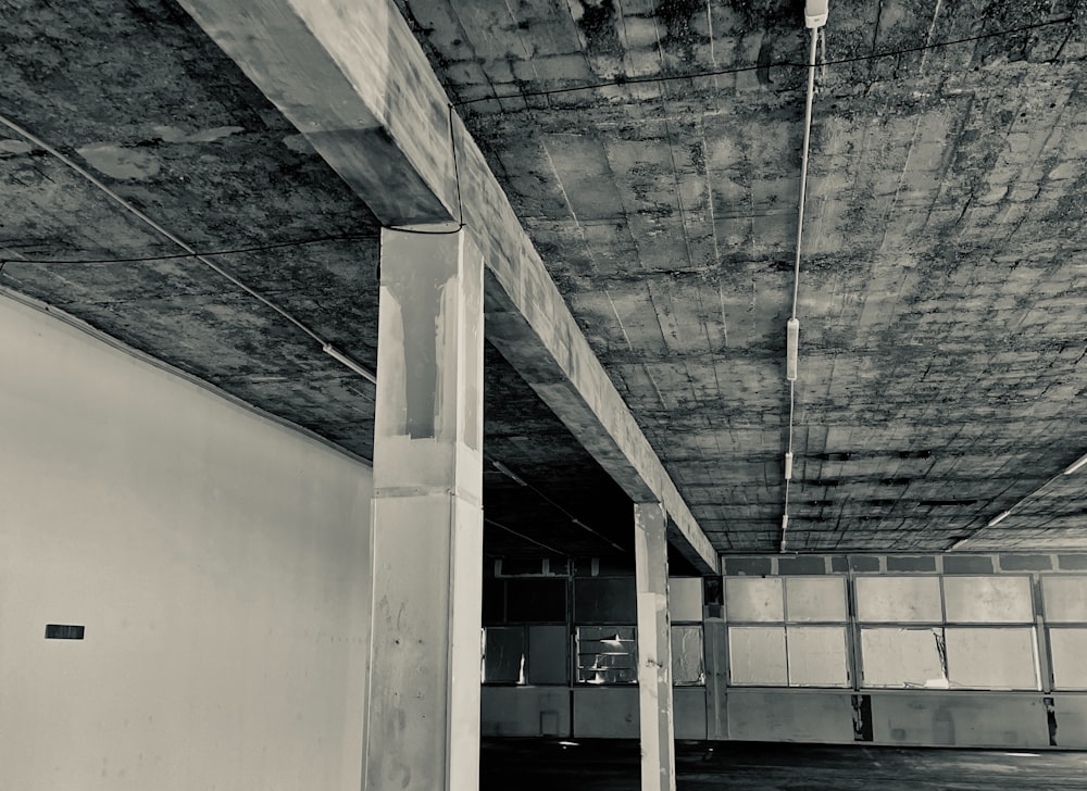 a black and white photo of a parking garage