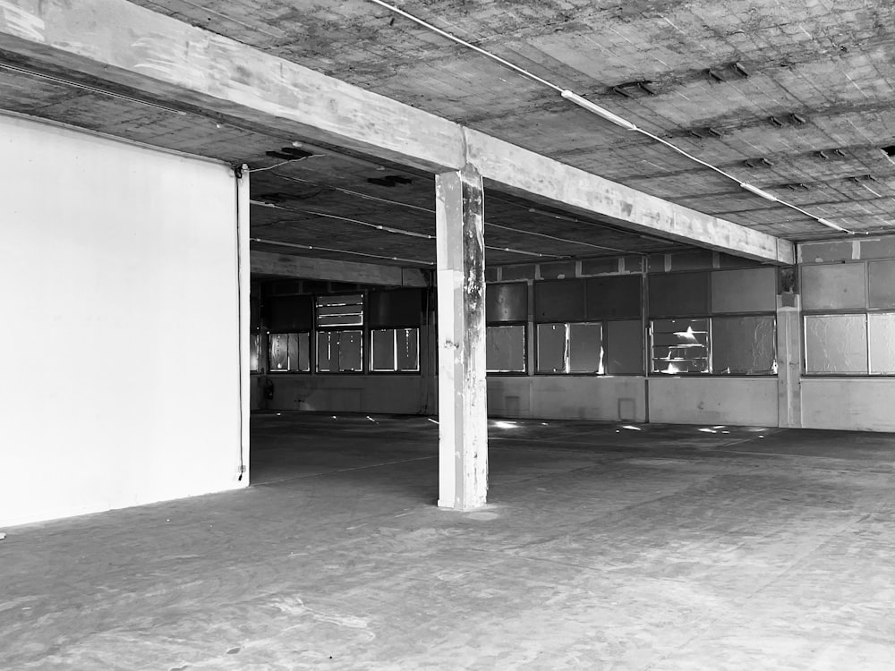 a black and white photo of an empty parking garage