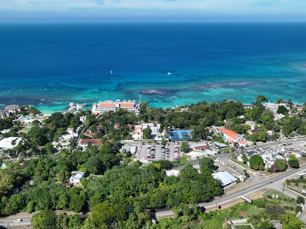 an aerial view of a town and the ocean