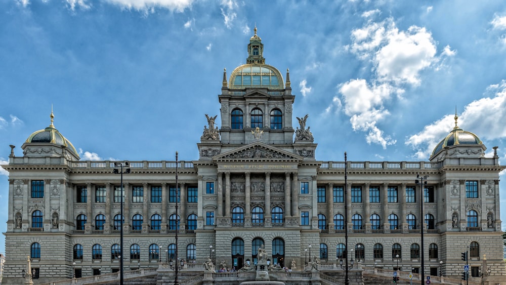 a large building with a fountain in front of it