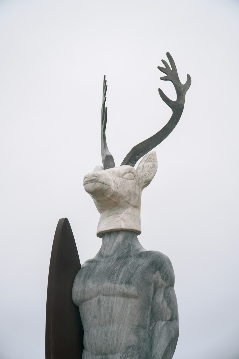 a statue of a man with antlers on his head