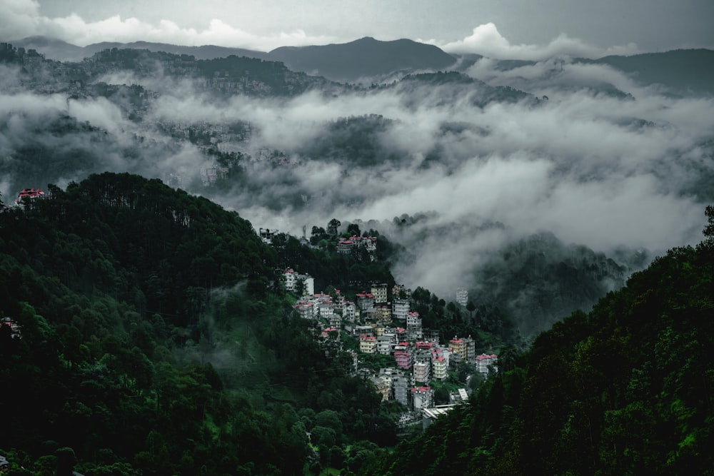 a view of a town nestled in the mountains