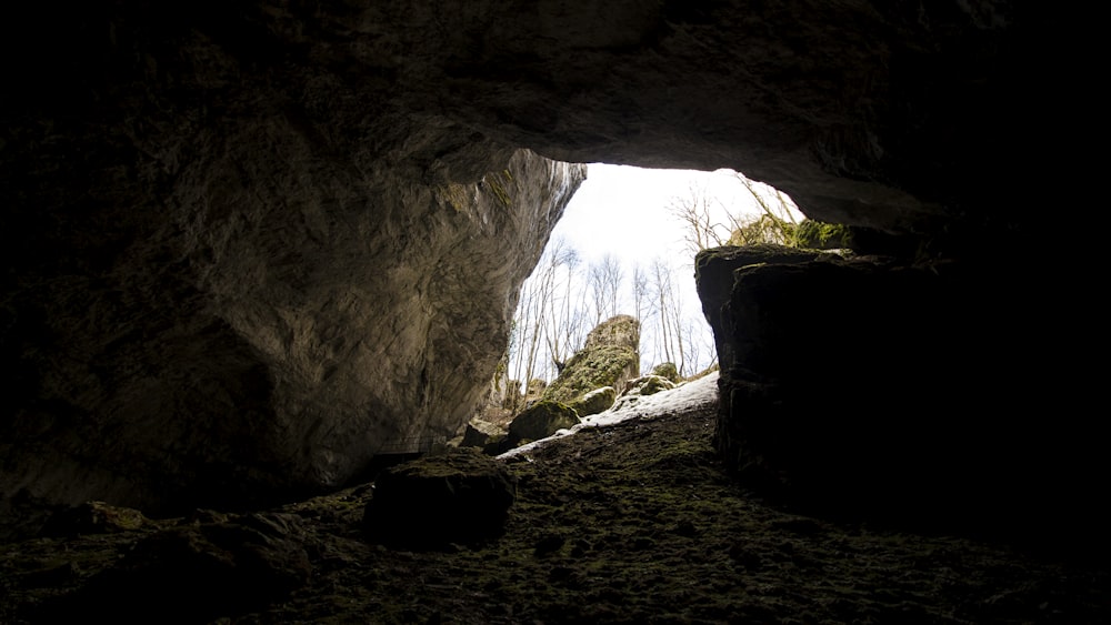 a dark cave with a light at the end