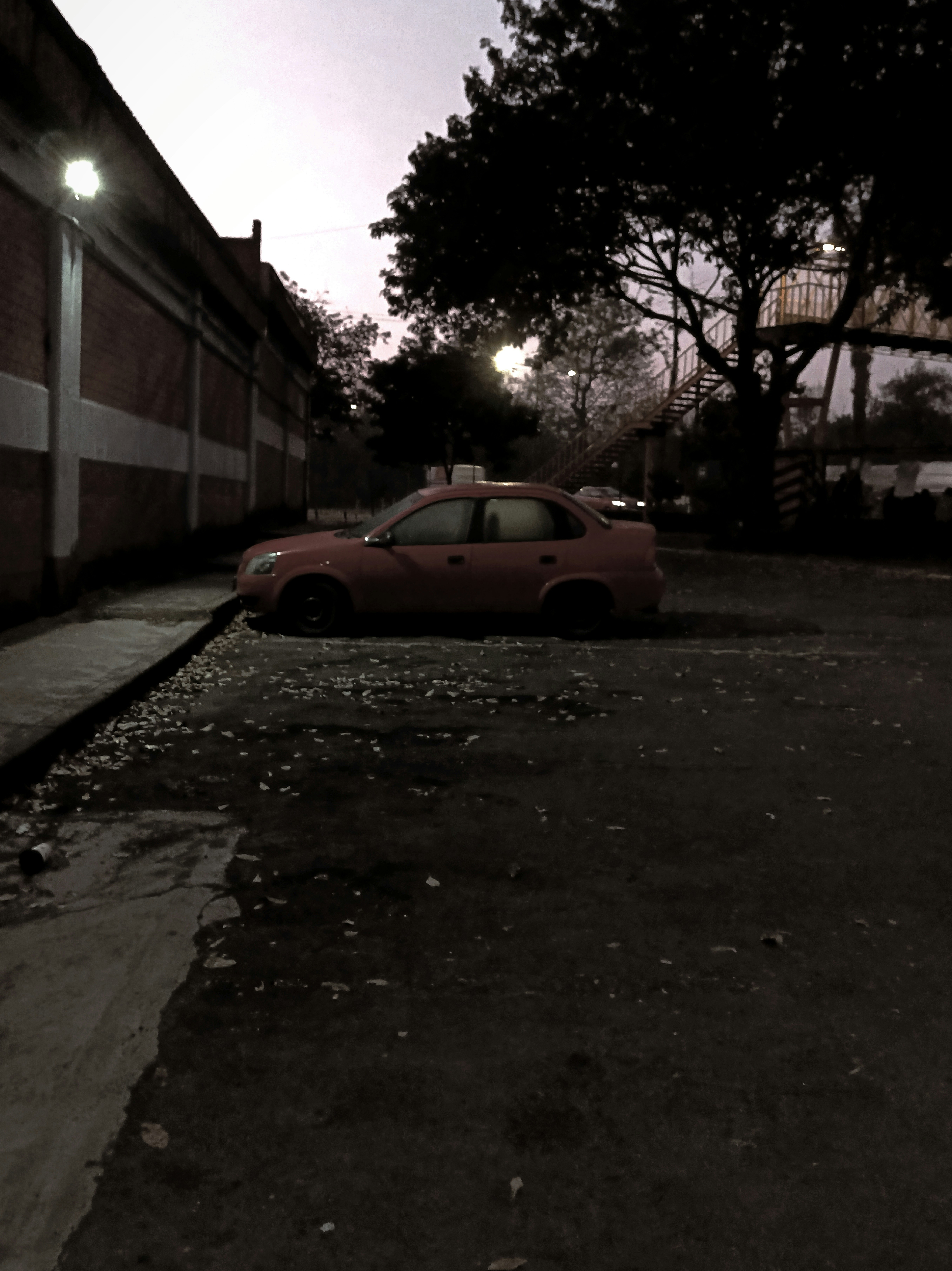 A red car parked on the side of a road photo – Free Car Image on Unsplash