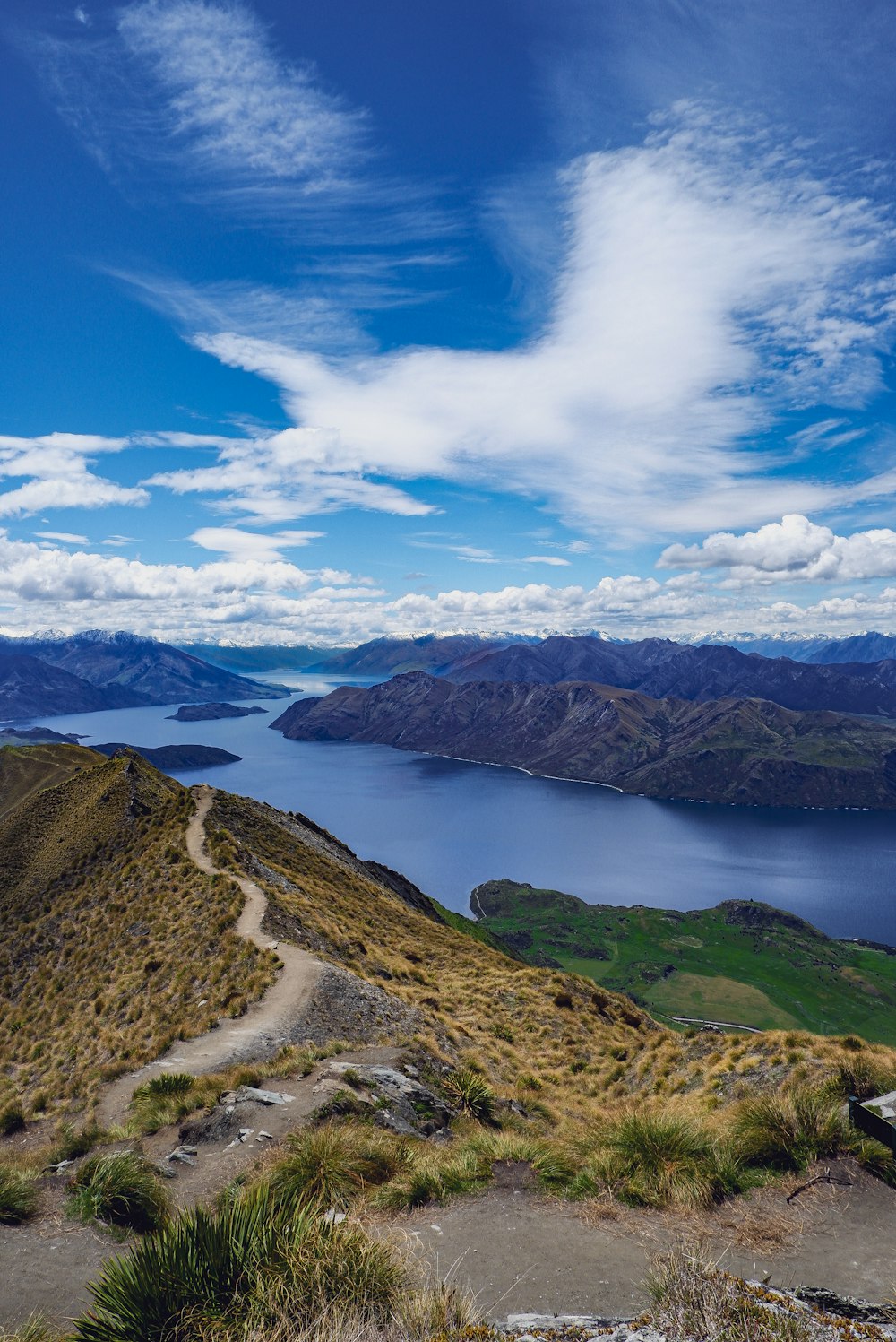 a scenic view of a lake and mountains