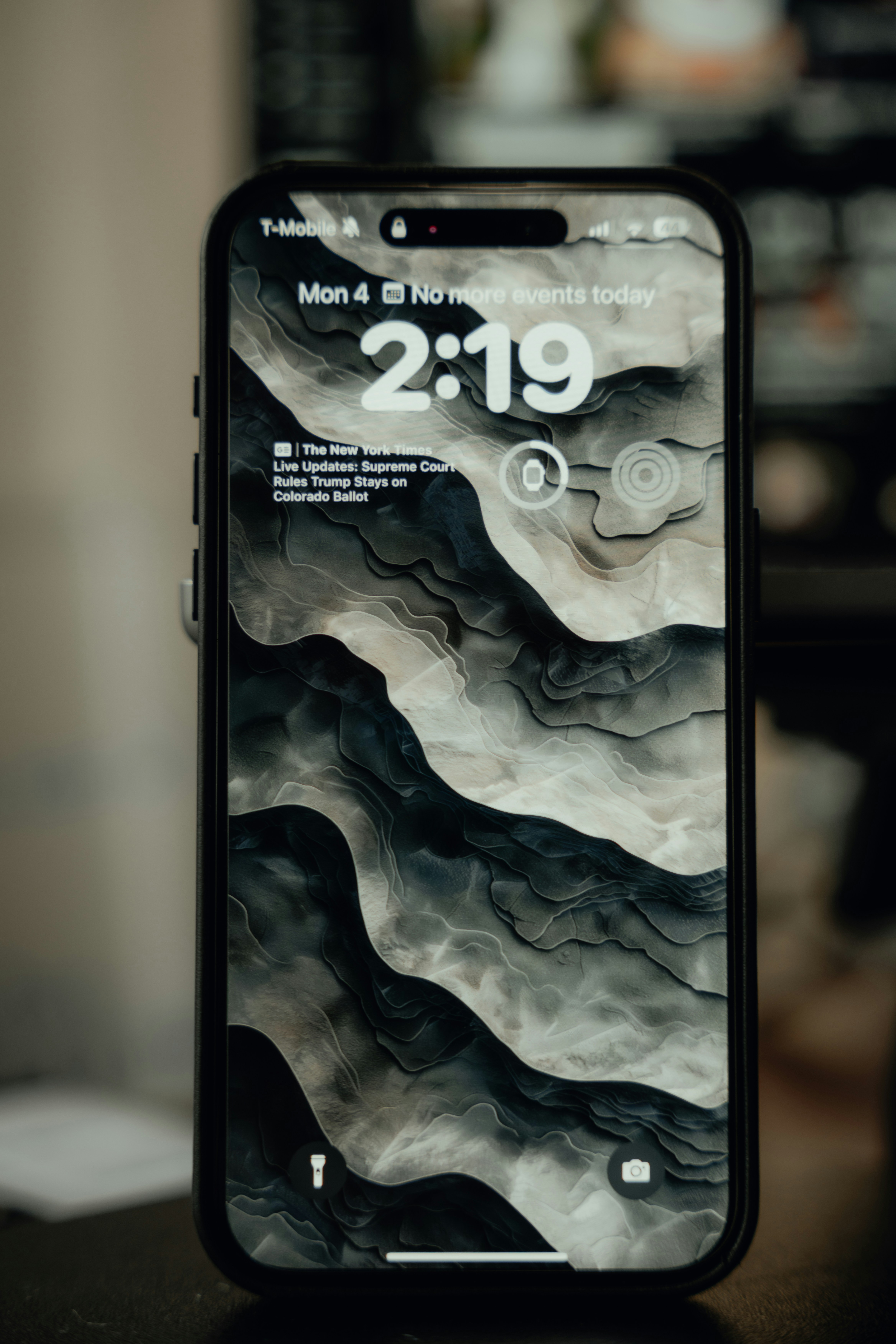 a cell phone with the time displayed on it