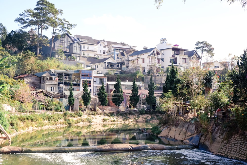 a river running through a lush green hillside