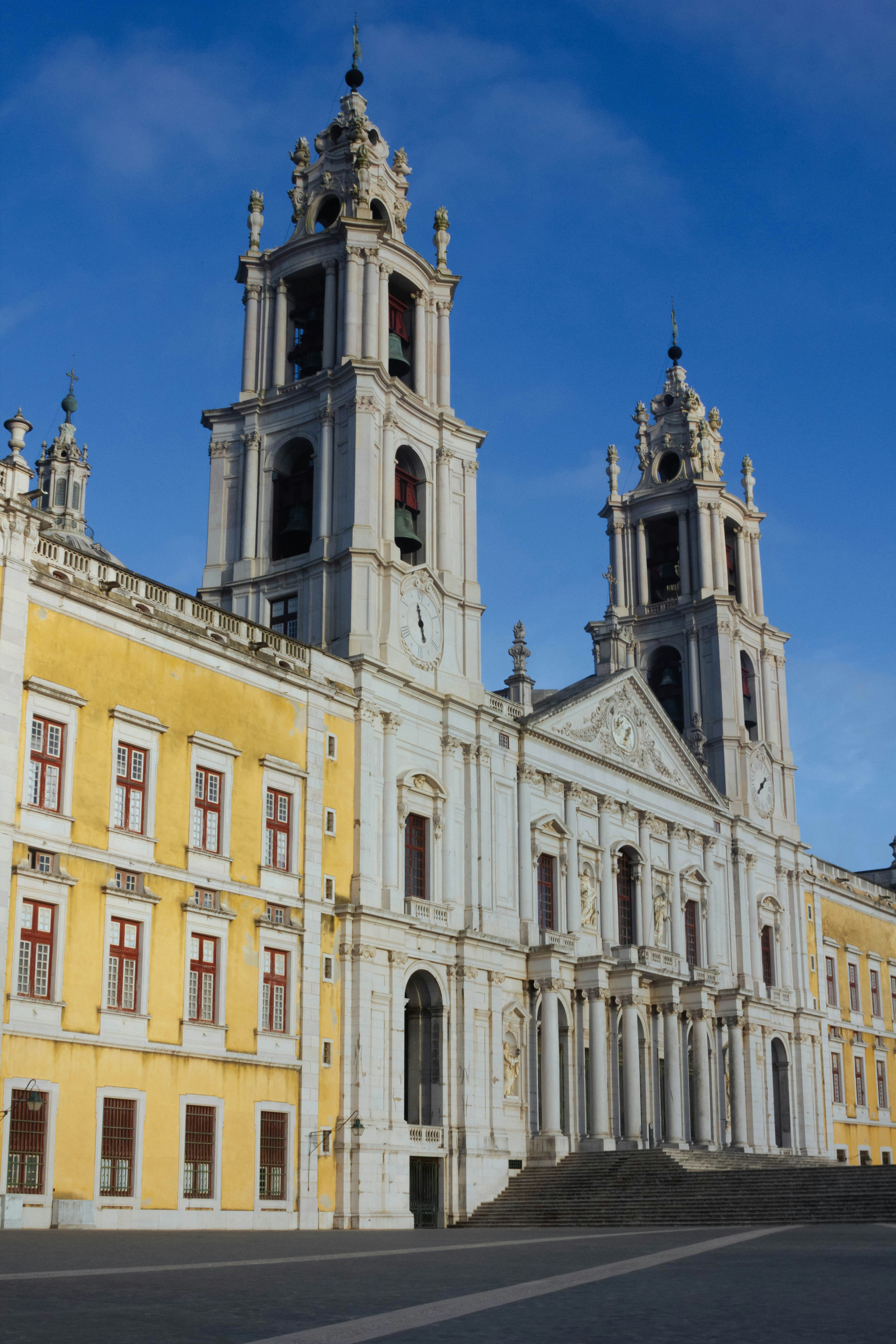 a large building with two towers and a clock