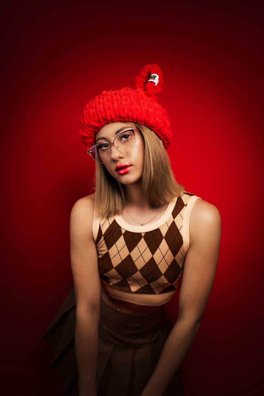 a woman wearing a red hat and glasses