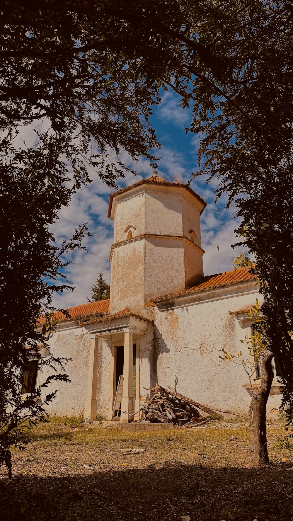 an old building with a clock on the top of it