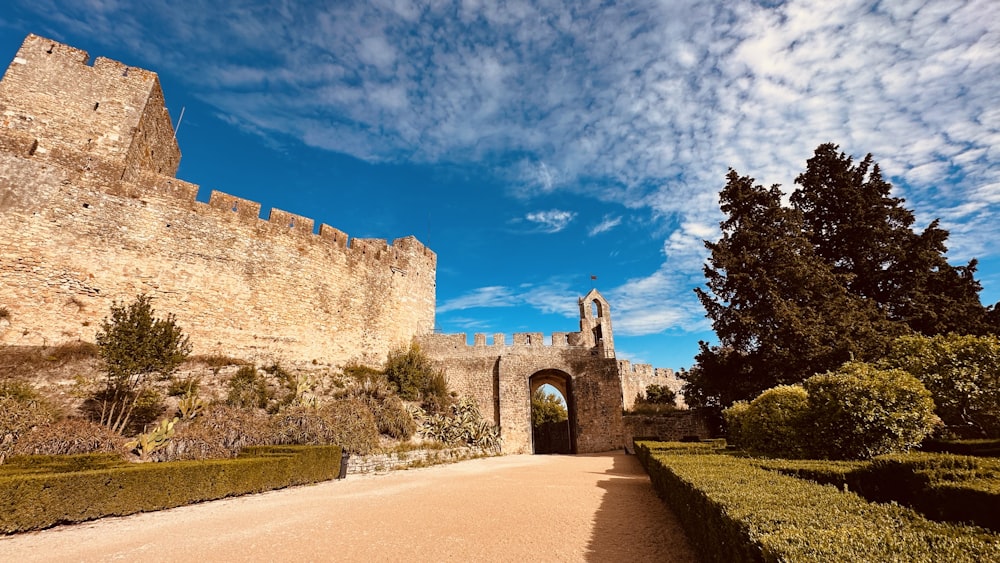 a castle with a walkway leading to it