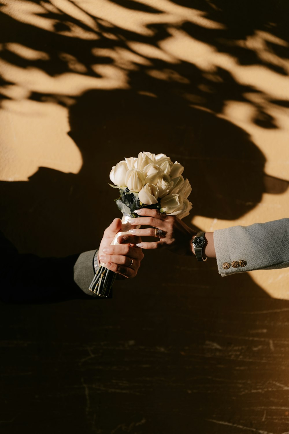 a person holding a bouquet of flowers in their hands