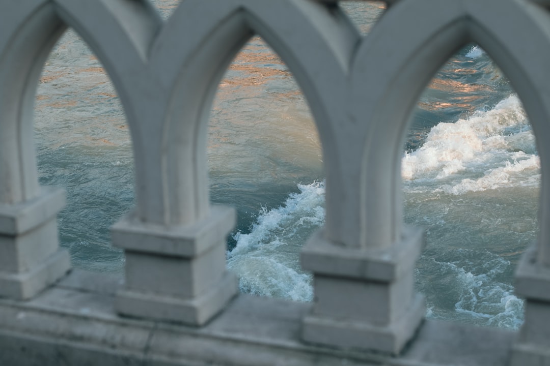 a view of a body of water from a bridge,