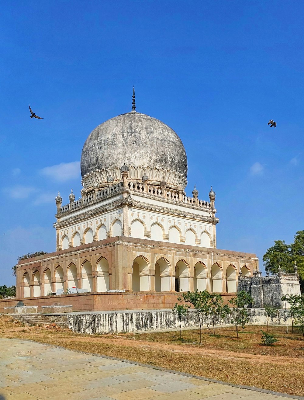 a large white building with a dome on top