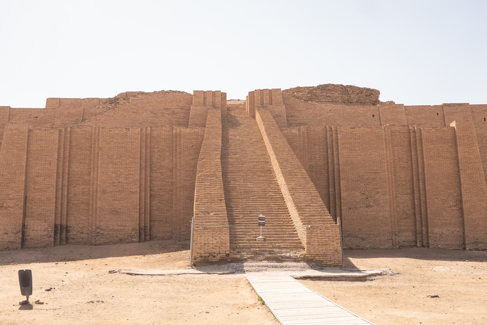 a very tall brick structure with steps leading up to it