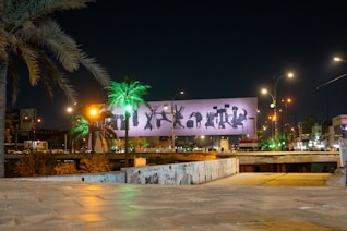 a large billboard is lit up at night